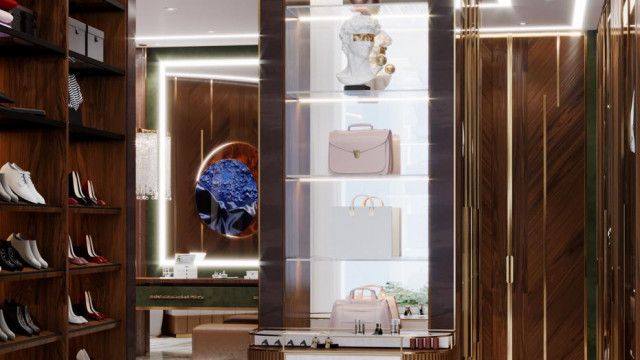 Luxurious interior featuring an ornate chandelier, upholstered furniture, and a plush, patterned rug.