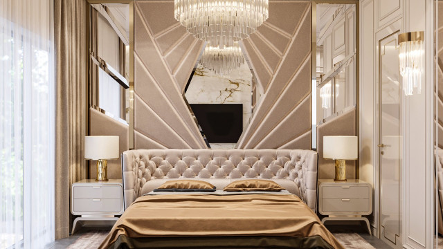 Modern luxury bedroom featuring a neutral palette of white, gold, and light grey. Upholstered headboard matching bedspread and pillows. Acrylic nightstand with golden detailing.