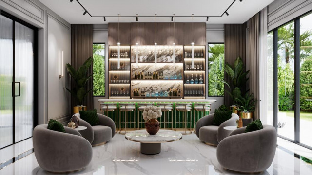 Modern luxury living room featuring a velvet upholstered sofa, chaise, and armchair, with a marble fireplace, chandelier, and accents of decorative pillows.