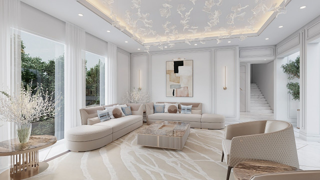 An ornately decorated, luxuriously furnished interior space with taupe walls, white crown molding, and architectural details in white, gold, and beige tones.