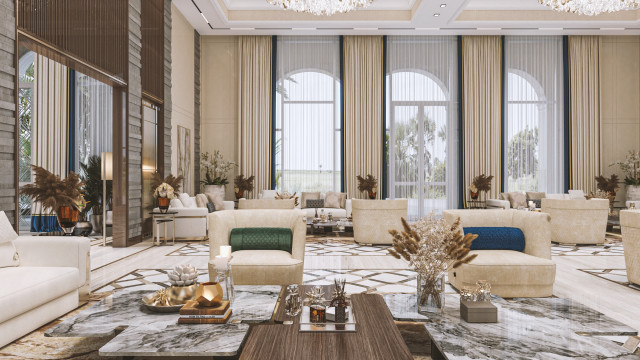 A contemporary living room with upholstered furniture, a glass coffee table, and a geometric patterned accent wall.