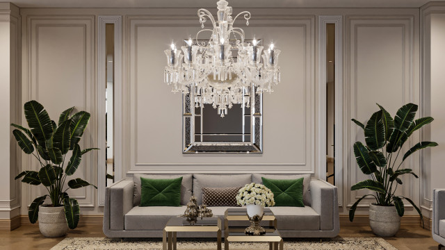 Luxurious contemporary living room with upholstered furniture, an accent wall, and a chandelier.