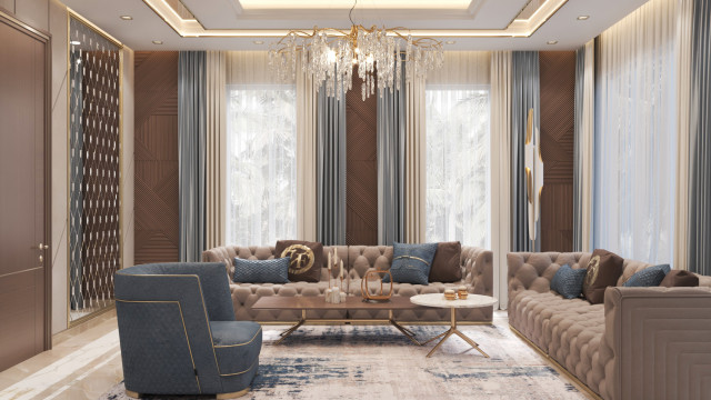 Luxurious modern living room with beige furniture, neutral accent wall and large windows overlooking outdoor scenery.