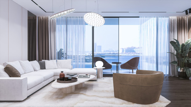 Modern luxurious bedroom with a bed, nightstands, ottoman, and armchair upholstered in cream velvet, featuring gold-toned accents, wall art, and drapery.