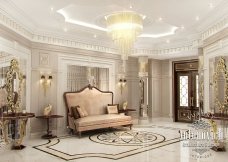 The picture shows a close-up of a white and pink Magnolia flower. The center of the flower is yellow and there is a cluster of petals around it. The petals are a mix of light and dark pink, giving the flower a two-tone look.