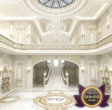 This picture shows a group of people gathered around a large bonfire at night. They are all wearing warm clothing and are roasting marshmallows over the fire. There are trees in the background and stars in the night sky above.