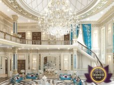 This picture shows a group of people practicing yoga outdoors on the beach. They are in various poses and some of them have their eyes closed in concentration. The blue sky, turquoise sea, and golden sand provide a beautiful backdrop for the activity.